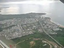 Aerial view of a coastal city from inland