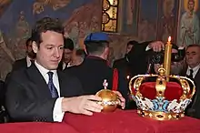 Prince Philip placing the Royal Orb near the Karađorđević Crown (2013)