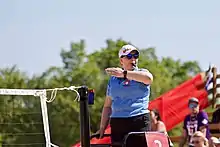 Image 6A beach volleyball referee determines if a fault has been committed. (from Beach volleyball)
