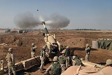 Image 2M198 howitzerPhoto credit: L Cpl. Samantha L. Jones, USMCNine Marines from Mike Battery, 4th Battalion, 14th Marines operate the 155mm M198 howitzer in November 2004. The battery was based at Camp Fallujah, Iraq and was supporting Operation Phantom Fury. All nine members of the M198 crew are present.More selected pictures