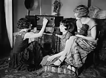 Image 70Around 1920, radio broadcasting started to get popular. The Brox Sisters, a popular singing group, gathered around the radio at the time. (from History of radio)