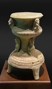 Image 6A Greek statue from a tomb, the figure is offering a bird. (from History of the United Arab Emirates)