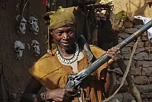 Image 28A Dogon hunter with an old flintlock rifle still in use. (from Culture of Mali)