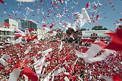 Image 15Thousands of Gibraltarians dress in their national colours of red and white and fill Grand Casemates Square during the 2013 Gibraltar National Day celebrations (from Culture of Gibraltar)