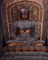Jin dynasty (1115–1234) statue of Amoghasiddhi in Shanhua Temple in Datong, Shanxi, China, one out of a set of statues of the Five Tathagathas