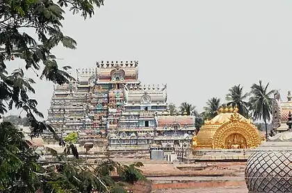 Image 15The golden Vimana over the sanctum at Srirangam midst its gopurams, its gable with Paravasudeva image. (from Tamils)