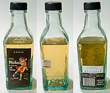Image 20Various views of a bottle of mezcal. The "worm", which is actually the larval form of the moth Hypopta agavis that lives on the agave plant, can be seen in the middle image, at the bottom of the bottle. (from List of alcoholic drinks)
