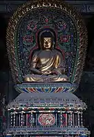Ming dynasty (1368–1644) statue of Amoghasiddhi in Huayan Temple in Datong, Shanxi, China, one out of a set of statues of the Five Tathagathas