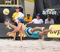 Image 19Unlike indoor volleyball, beach volleyball is played on soft sand which makes it safer for players to dive. Picture shows Nick Lucena of the United States diving to "dig" the ball. (from Beach volleyball)