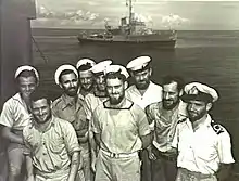 Image 68Australian sailors with a Bathurst-class corvette in the background. The RAN commissioned 56 of this class of corvettes during World War II. (from History of the Royal Australian Navy)