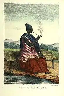 Image 5The Queen of Waalo - Lingeer Ndaté Yalla Mbodj (1810–1860) in her royal dress, seating and smoking a pipe.Credit: Llanta. Lithographer, Abbot P. David Boilat, author of text in his book Esquisses sénégalaises (1853). Source: cote : Gallica, bnf.fr - Réserve DT 549.2 B 67 M Atlas - planche n °5 - Notice n° : FRBNF38495418 - (Illustrations de Esquisses sénégalaises). Uploader to Wiki Commons   Patricia.fidiMore about Ndaté Yalla Mbodj...