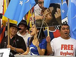 Protesters with the Kökbayraq in front of the UN building in New York City