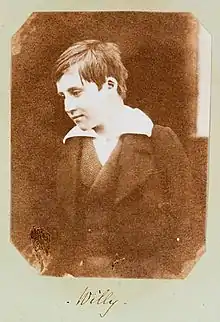A photograph of Welsh boy, William Mansel (1838-1866) titled 'Willie', smiling at something off camera. Taken c.1853, it is the earliest known photograph of a smile