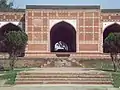 The tomb's façade is decorated with pietra dura