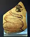 Shard of pottery decorated with a snake sticking out its tongue. Tell Arpachiyah, Iraq. Halaf period (6000-5000 BC). British Museum.