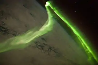 Image 16Aurora australisPhoto: NASA/ISS Expedition 23 crewThe aurora australis, as seen from the International Space Station. Aurorae are natural light displays in the sky caused by the collision of energetic charged particles with atoms in the high altitude thermosphere. The particles originate in the magnetosphere and solar wind and, on Earth, are directed by Earth's magnetic field into the atmosphere.More selected pictures