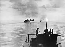 Image 41HMAS Australia and Arunta bombarding Cape Gloucester (from Military history of Australia during World War II)