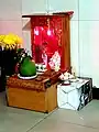 The altar of Ông Tài - Ông Địa at a restaurant