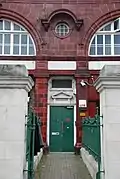 Standard design was also employed when an outside door was part of the build for access to the upper floor(s). A triangular pediment above the doorway and fanlight were the norm.