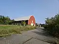 Bolton entrance to the Bolton Flats Management Area with cape and gambrel roof barn