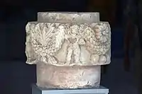 Capital with a figure showing features of Buddha and Heracles (100-200 CE), Old Termez Archaeological Museum.