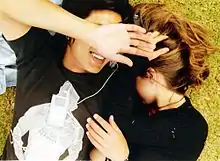 Image 22A young couple listening to music on an iPod Mini, 2006 (from Album era)