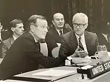 Yugoslav representative Dragoslav Pejić talking to George H. W. Bush at the United Nations Security Council meeting on 14 July 1988.