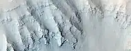 Close view of layers in the Louros Valles, as seen by HiRISE under HiWish program; this is an enlargement of a previous image.