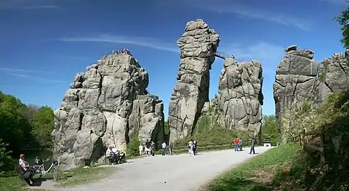 Image 10ExternsteinePhoto credit: Daniel SchwenThe Externsteine, a distinctive rock formation located in the Teutoburger Wald region of northwestern Germany, are a popular tourist attraction. Stairs and a small bridge connecting two of the rocks lead to the top.