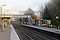 The station footbridge, with new catenary masts visible beyond.