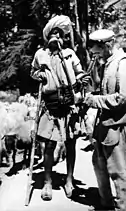 Gaddi village men with hookah, on a mountain path near Dharamshala, India