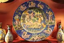 Central dish is 58 cm across, the main scene the Rape of Europa, after an illustration of Ovid by François Chauveau, published in 1674
