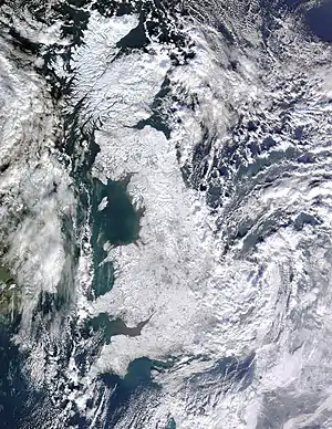 Image 14Winter of 2009–2010 in EuropePhoto: Jeff Schmaltz, MODIS Rapid Response Team, NASAA satellite photo of Great Britain and part of Ireland showing the extent of snow cover during the winter of 2009–2010, the coldest in Europe since 1981–82. Starting on 16 December 2009 a persistent weather pattern brought cold moist air from the north with systems undergoing cyclogenesis from North American storms moving across the Atlantic Ocean to the west, and saw many parts of Europe experiencing heavy snowfall and record low temperatures.More selected pictures