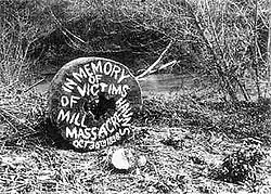 a round millstone painted with the words "in memory of victims of haun's mill massacre"
