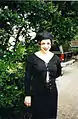 Image 63Woman dressed in black maxi skirt, top and hat, 1995. (from 1990s in fashion)