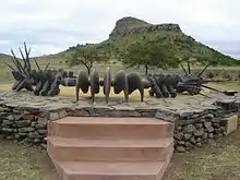 Image 19The monument to the Battle of Isandlwana depicts a beaded Zulu necklace similar to the one used for the original Wood Badge beads (from Wood Badge)