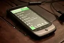 Image 8A smartphone displaying playlists on Spotify, 2010. The streaming service became a dominant and redefining platform for music consumption through the decade. (from Album era)