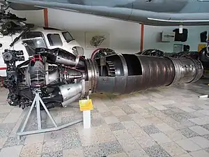 Klimov VK-1F turbojet with afterburner. An afterburner is a propulsive duct in which high velocity exhaust from an engine turbine is converted into pressure in a diffuser. Afterburner fuel is burned with the oxygen in the dilution air which was not involved in the engine combustion process. The gas expands in a nozzle with an increase in velocity. The turbojet afterburner has the same three requirements as a ramjet, both being propulsive ducts. These are conversion of high velocity gas into pressure in a diffuser, combustion and expansion to a higher velocity in a nozzle. As such the turbojet/afterburner combination was sometimes considered in the late 1940's a turbo-ramjet.