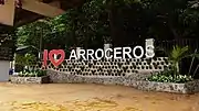 A stone sign containing "I love Arroceros" on a pedestrianized plaza.