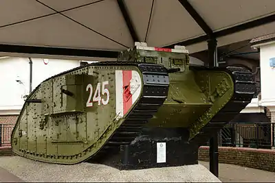Image 7Mark IV tankPhotograph: Peter TrimmingThe Mark IV tank was introduced by the British in May 1917 to fight in World War I. The "female" version, as pictured here, was armed with five machine guns. Production of the Mark IV ceased at the end of the War in 1918. A small number served briefly with other combatants afterwards.This Mark IV tank, on display in Ashford, Kent, was presented to the town after the end of World War I. The engine was removed to install an electricity substation inside it, though this substation was subsequently removed; the tank's interior is now empty.More selected pictures