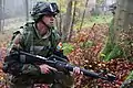 Image 3A soldier from Moldova pulls security while conducting a company situational training exercise during exercise Combined Resolve III at the Joint Multinational Readiness Center in Hohenfels, Germany, Oct. 26, 2014