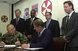 Image 25National Federation of Federal Employees officials sign a collective bargaining agreement with the U.S. 8th Army in October 2002.