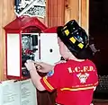 A large alarm gong that visitors may operate.  One of the many hands-on exhibits in the Aurora Regional Fire Museum.
