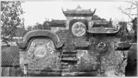 A Temple in Yong-hien, the city below the Great Buddha in 1910. Notice the two chimneys in the foreground.