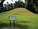 The primary mound, a steep, grass covered rise on an otherwise flat plain