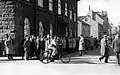 People gather in front of the House of the Althing.