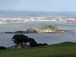 Image 20Northeastward view of Plymouth Sound from Mount Edgcumbe Country Park in Cornwall, with Drake's Island (centre) and, behind it from left to right, the Royal Citadel, the fuel tanks of Cattedown, and Mount Batten; in the background, the hills of Dartmoor. (from Plymouth)