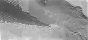 The edge of the dark dunes of Abalos Undae shown just below the polar scarp and cap