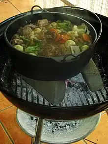 Image 13Potjiekos is a traditional Afrikaner stew made with meat and vegetables and cooked over coals in cast-iron pots. (from Culture of Africa)