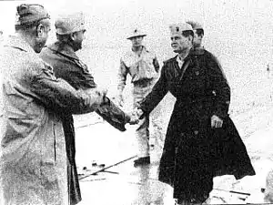 Major General Pedro del Valle (second from left) is greeted by Colonel Chesty Puller on Pavuvu in late October 1944, while Major General Rupertus (far left) looks on